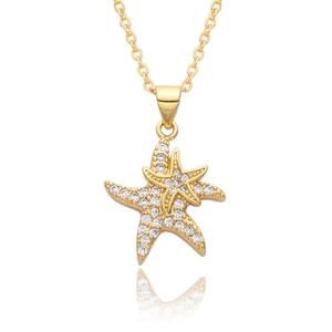 Elegant gold double starfish pendant necklace with sparkling cubic zirconia on white background