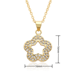 Macro detail of 16mm gold star pendant with micro-pave white cubic zirconia stones