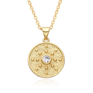 Detail of 18K gold-plated coin pendant with sunburst texture and white zircon center stone