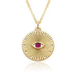 Close-up of gold-plated evil eye coin pendant with red ruby-like stone and white zircons
