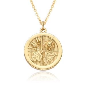 Vintage 18K gold plated coin pendant necklace with embossed floral patterns on white background
