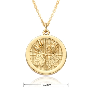 Macro detail of 18K gold coin pendant with four seasons floral engraving and 19.7mm size