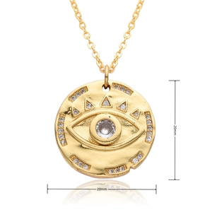 Detail of 20mm round evil eye pendant with micro-pave cubic zirconia in gold plating