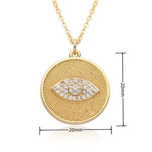 Close-up of a 20mm gold-plated evil eye pendant necklace with micro-pave cubic zirconia