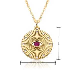 Detail view of 18mm gold evil eye pendant necklace with red and white cubic zirconia