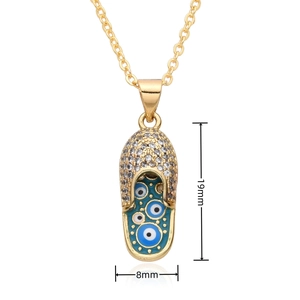 Detail showing dimensions of the gold slipper pendant with evil eye enamel and zircons