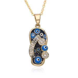 Golden flip-flop pendant necklace with blue evil eye enamel and pavé rhinestones