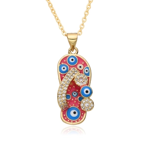 Macro shot of pink flip-flop pendant with evil eye pattern and sparkling rhinestones