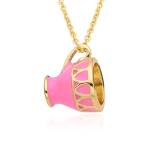 Macro view of pink enamel teacup pendant with gold filigree detail on long chain
