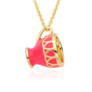 Detailed close-up of a red enamel magic teacup pendant on a gold-plated link chain