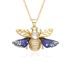 Detailed macro view of bee pendant with purple gradient wings and micro-set zircon crystals