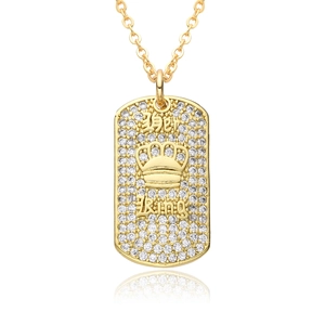 Macro view of gold plated Her King pendant necklace with white zircon pavé and crown detail