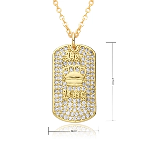 Detail view of 18k gold pendant with Her King crown engraving and clear zircon stones