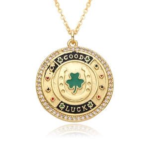 Gold lucky compass pendant necklace with green clover, horseshoe and white zircon accents