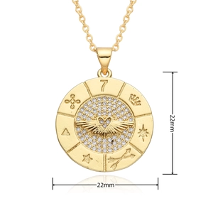 Macro detail of a 22mm gold-plated clock pendant with micro-paved zircons and winged heart