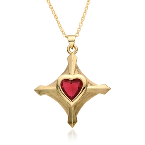 Close-up of gold plated star pendant with sparkling red heart-shaped zircon stone