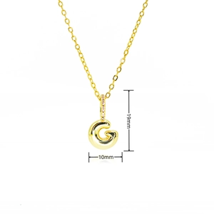 Detail view of gold letter G bubble pendant with pink zircon inlay and dimensions
