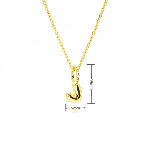 Macro detail of gold letter J balloon pendant with zircon inlay and 19mm size scale