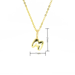 Detail showing dimensions of a 21mm gold puffy M letter pendant with pavé cubic zirconia