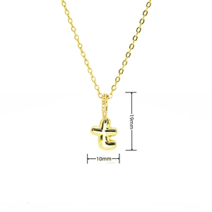 Detail showing the 19mm height of the gold letter t pendant with cubic zirconia inlay