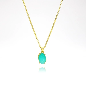 Elegante goldene Halskette mit ovalem blauem Zirkon-Anhänger in einer Vier-Krallen-Fassung