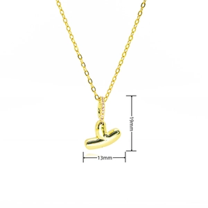 Detail view of gold bubble letter pendant with zircon inlay and dimensions 19mm by 13mm