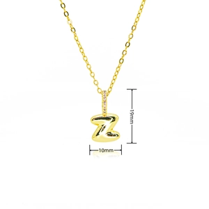 Detail of gold bubble letter Z pendant with purple cubic zirconia stones on the bail