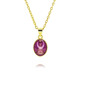 Detail of vintage oval pendant necklace with purple enamel and golden goddess embossing