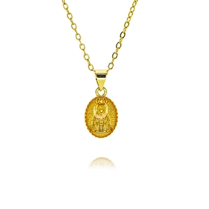 Macro detail of oval gold necklace with religious Virgin Mary pendant and rays