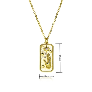 Detailed view of square gold sun tag pendant with hamsa hand and purple gemstones