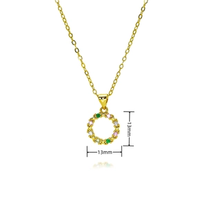 Detail shot of 13mm gold pendant with multi-color cubic zirconia on a thin cross chain