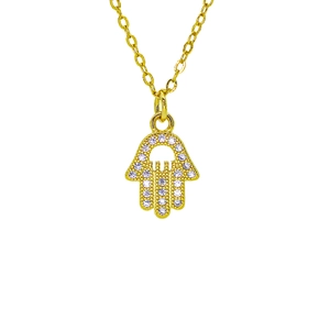 Macro shot of gold Hamsa pendant with purple zircon inlay and delicate cross chain