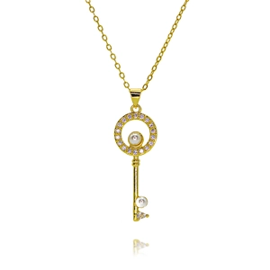 Close-up of gold plated key necklace pendant with zircon pavé and white pearls