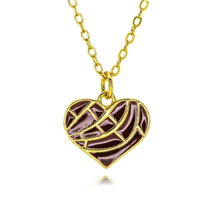 Close-up of golden heart pendant with dark red enamel and textured grid pattern