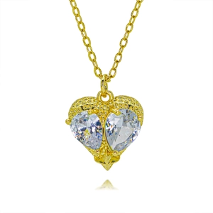 Close-up of heart pendant with two pear-cut cubic zirconia stones and gold chain