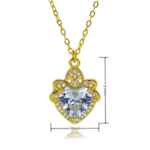 Detail of heart pendant with large clear stone and gold finish measuring 21mm by 16mm