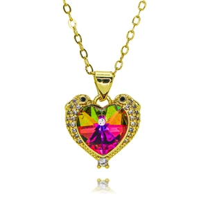 Detailed view of heart-shaped crystal necklace with gold chain and zircon inlay