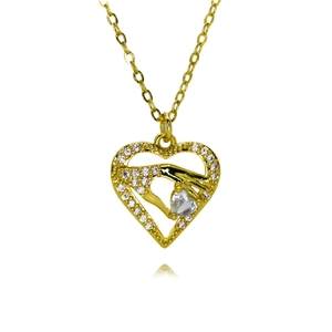 Close-up of gold heart pendant necklace featuring zircon-encrusted edge and hand detail