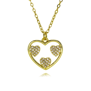 Close-up of golden heart pendant necklace with three small sparkling zircon hearts