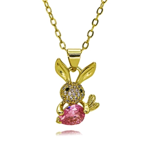 Macro detail of gold rabbit pendant with pink teardrop stone and zircon micro-pave