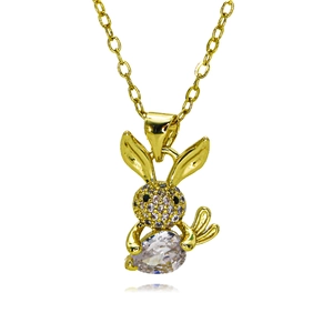 Detailed macro of golden rabbit pendant with micro-pave zircon and a large teardrop crystal