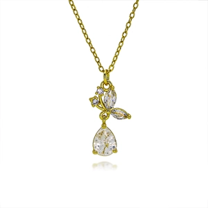 Macro view of butterfly pendant with marquise and pear-shaped zircon on golden chain