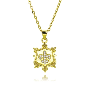 Macro shot of 18k gold plated octopus shield pendant with micro-set sparkling crystals