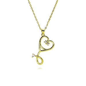 Detailed close-up of golden stethoscope heart pendant necklace with three zircon stones