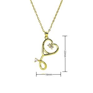 Golden stethoscope heart necklace with white crystals, dimensions 23mm x 16mm