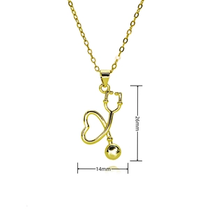 Detailed size view of the gold stethoscope and heart necklace measuring 26mm by 14mm