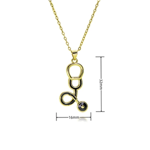 Detail showing stethoscope pendant dimensions of 32mm by 16mm in gold and black finish