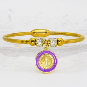 Detailed macro view of the gold-plated religious pendant with purple enamel and zircons