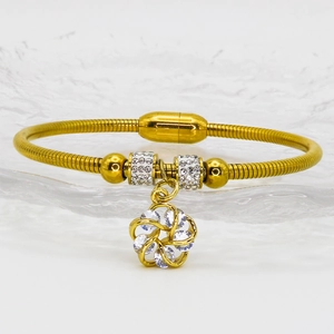 Gold leaf floral magnetic bracelet with shimmering rhinestones and a spinning pendant