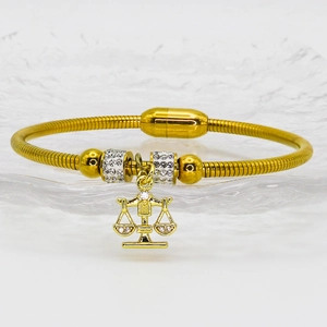 Goldfarbenes Waage-Sternzeichen-Schlangenarmband mit Magnetverschluss und Kristallen